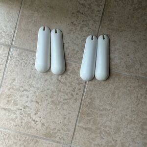White plastic hangers. Plastic pads that can be used for sweaters  2 sets